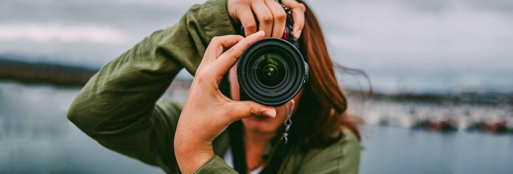 women holding a camera